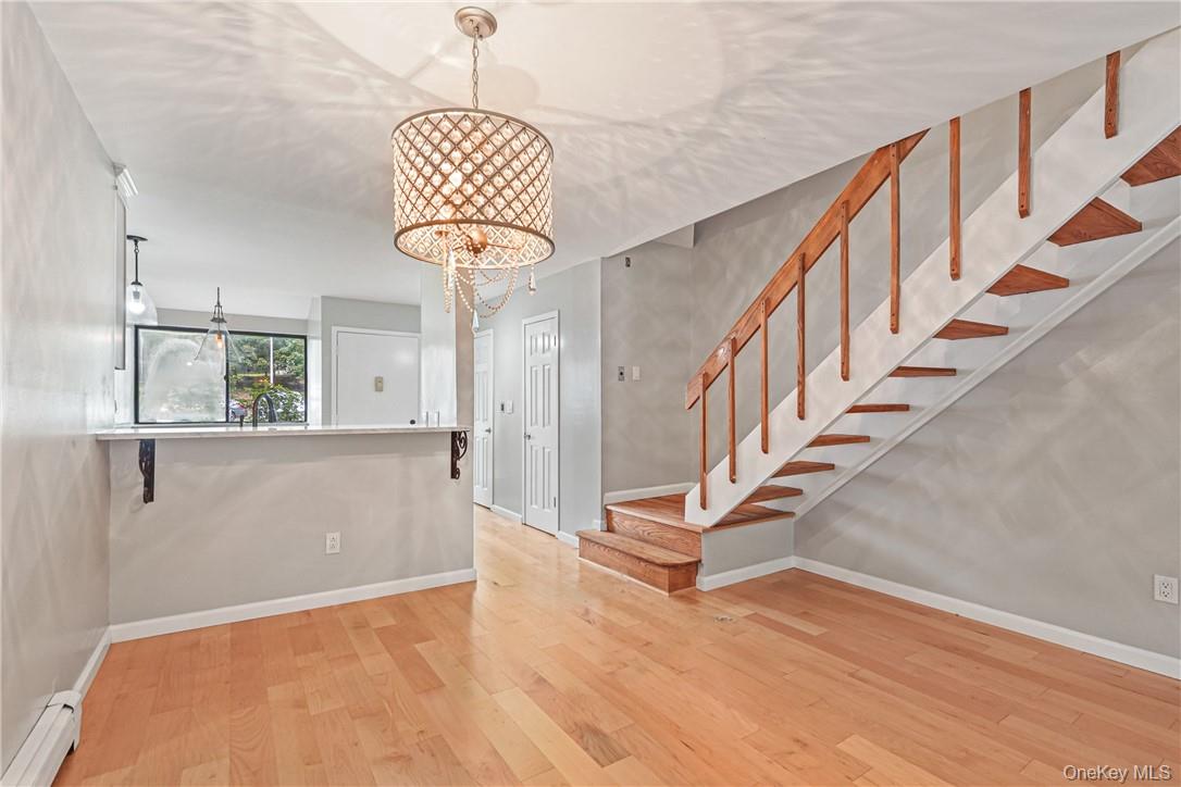 118 Round Hill Road Dobbs Ferry, NY 10522 - Photo 13 of 16 a view of entryway and hall with wooden floor