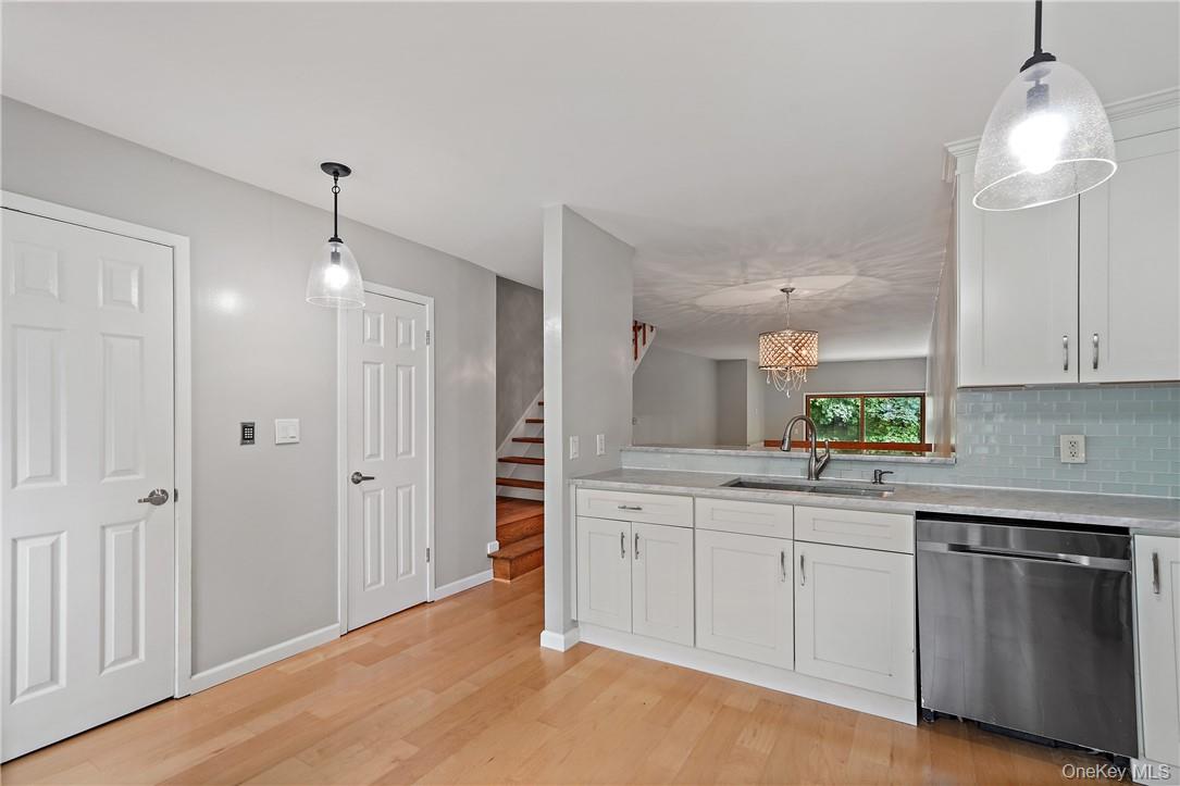 118 Round Hill Road Dobbs Ferry, NY 10522 - Photo 3 of 16 a kitchen with white cabinets and sink