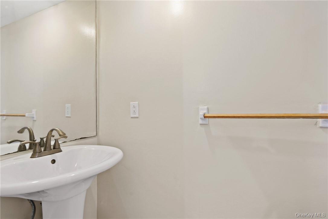 118 Round Hill Road Dobbs Ferry, NY 10522 - Photo 4 of 16 a bathroom with a sink and a mirror