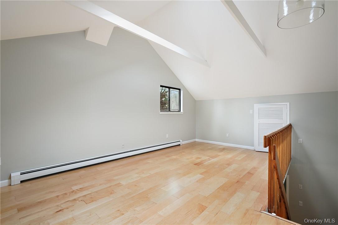 118 Round Hill Road Dobbs Ferry, NY 10522 - Photo 9 of 16 a view of an empty room with wooden floor and a window