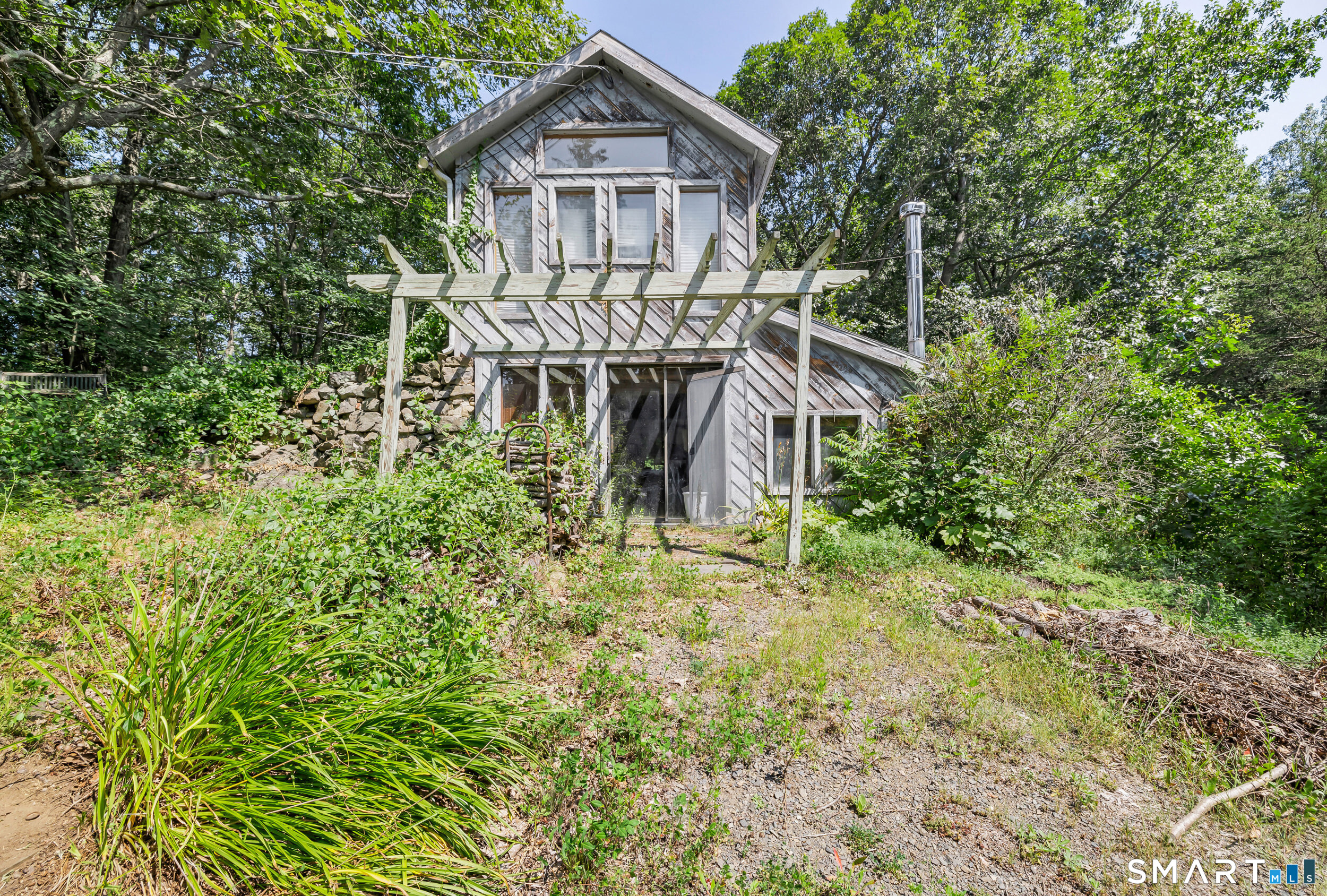 90 A Rowley Road Woodbury, CT 06798 - Photo 34 of 40 a house with trees in front of it