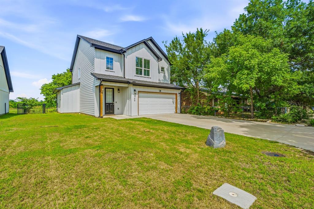 745 North Miller Avenue Stephenville, TX 76401 - Photo 2 of 31 Contemporary two-story residence featuring white siding and black trim accents