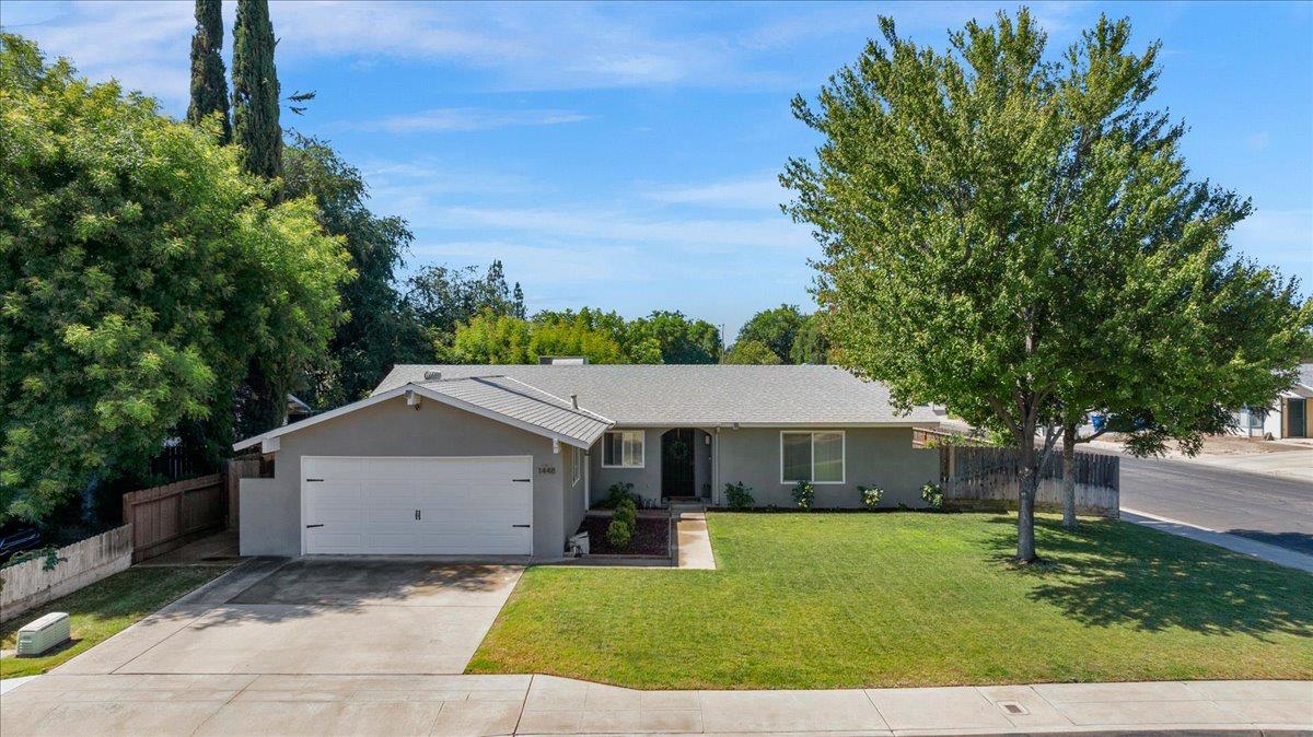 1448 Ashcroft Avenue Clovis, CA 93611 - Photo 1 of 46 a front view of a house with a yard
