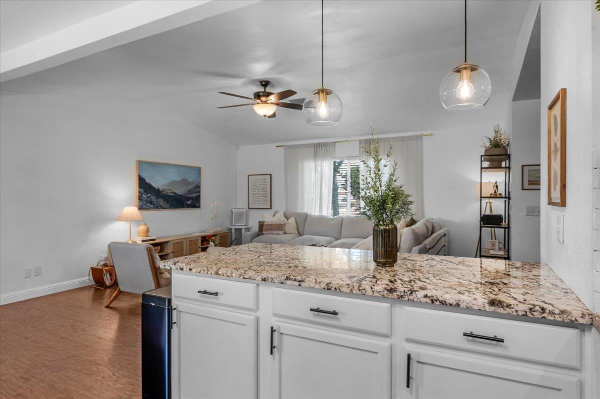 1448 Ashcroft Avenue Clovis, CA 93611 - Photo 15 of 46 a view of living room with granite countertop furniture and fireplace