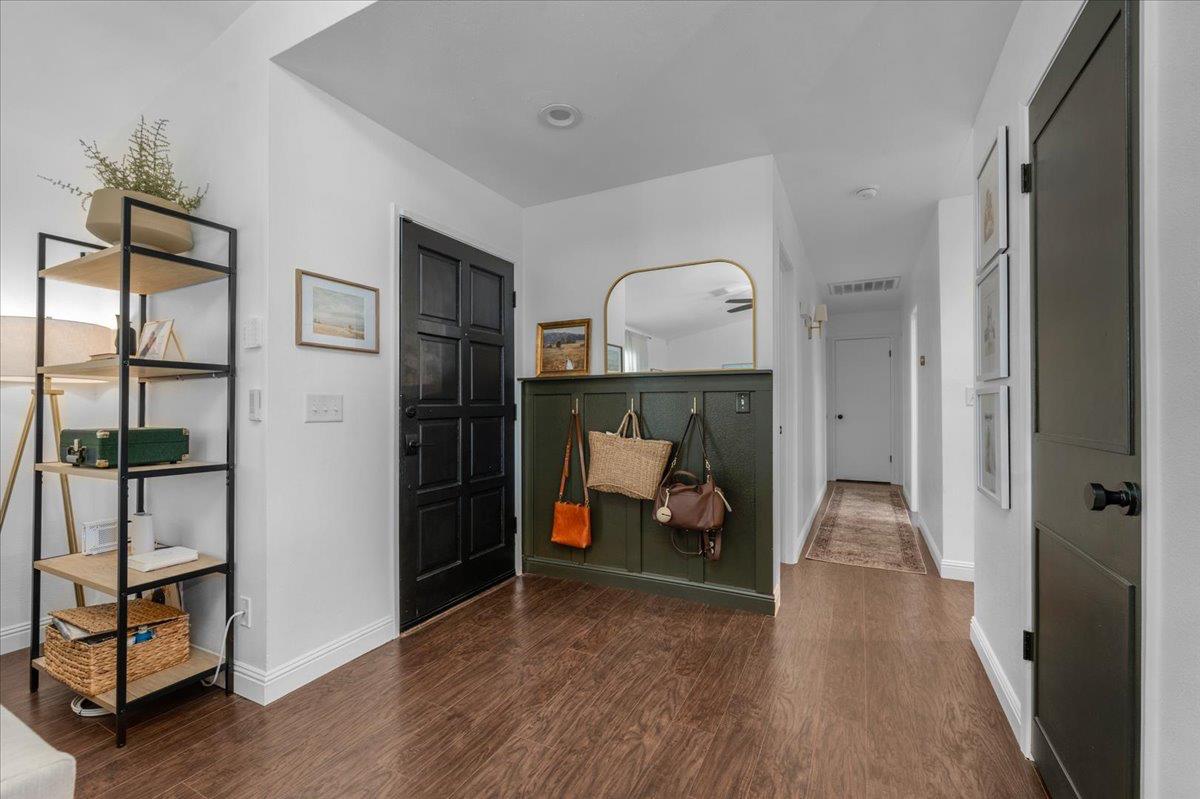 1448 Ashcroft Avenue Clovis, CA 93611 - Photo 18 of 46 a view of a livingroom with wooden floor and a ceiling fan