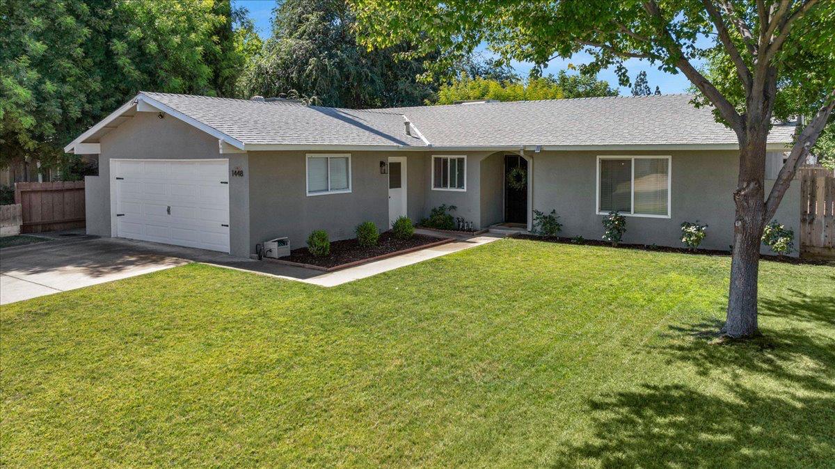 1448 Ashcroft Avenue Clovis, CA 93611 - Photo 2 of 46 a view of a house with a yard and tree
