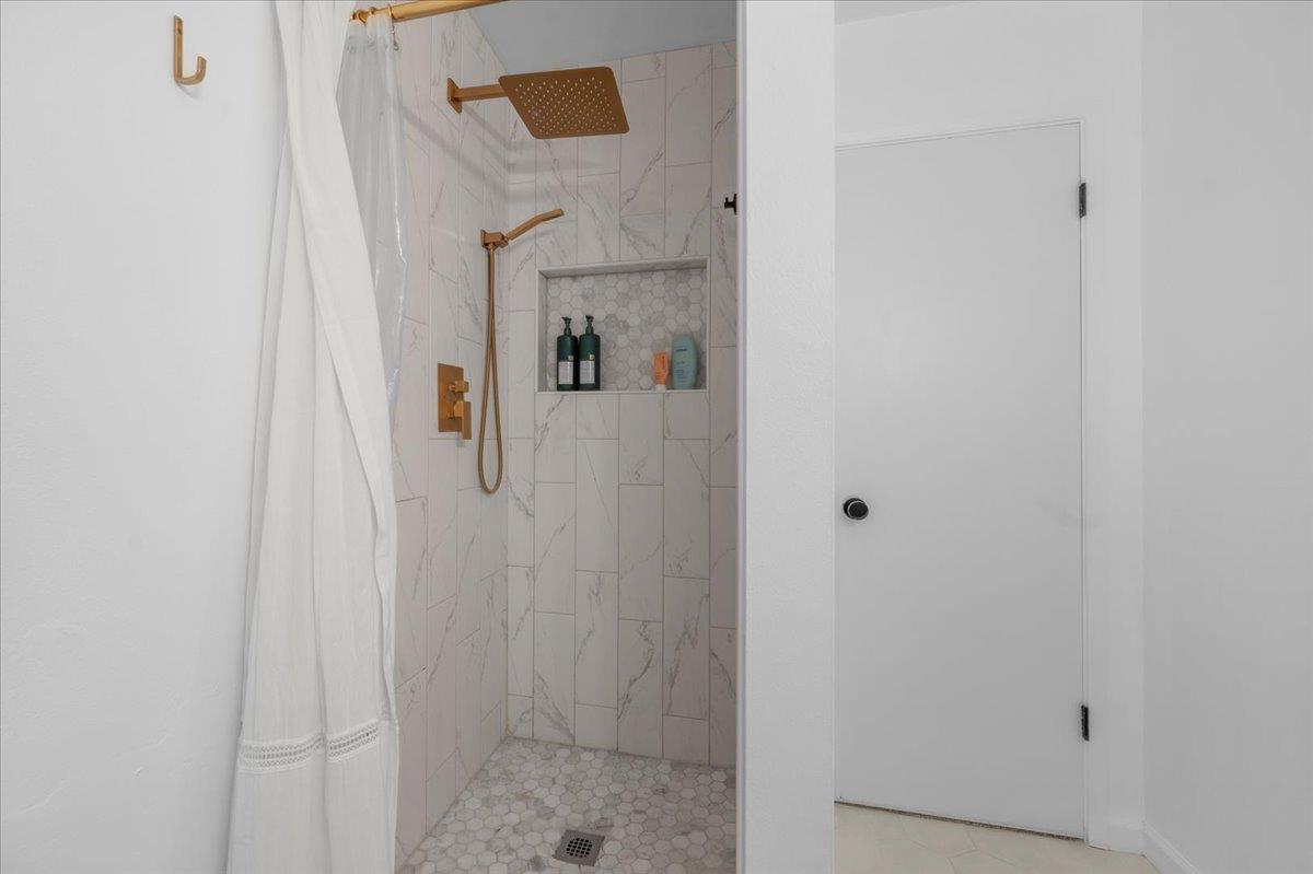 1448 Ashcroft Avenue Clovis, CA 93611 - Photo 27 of 46 a bathroom with a shower