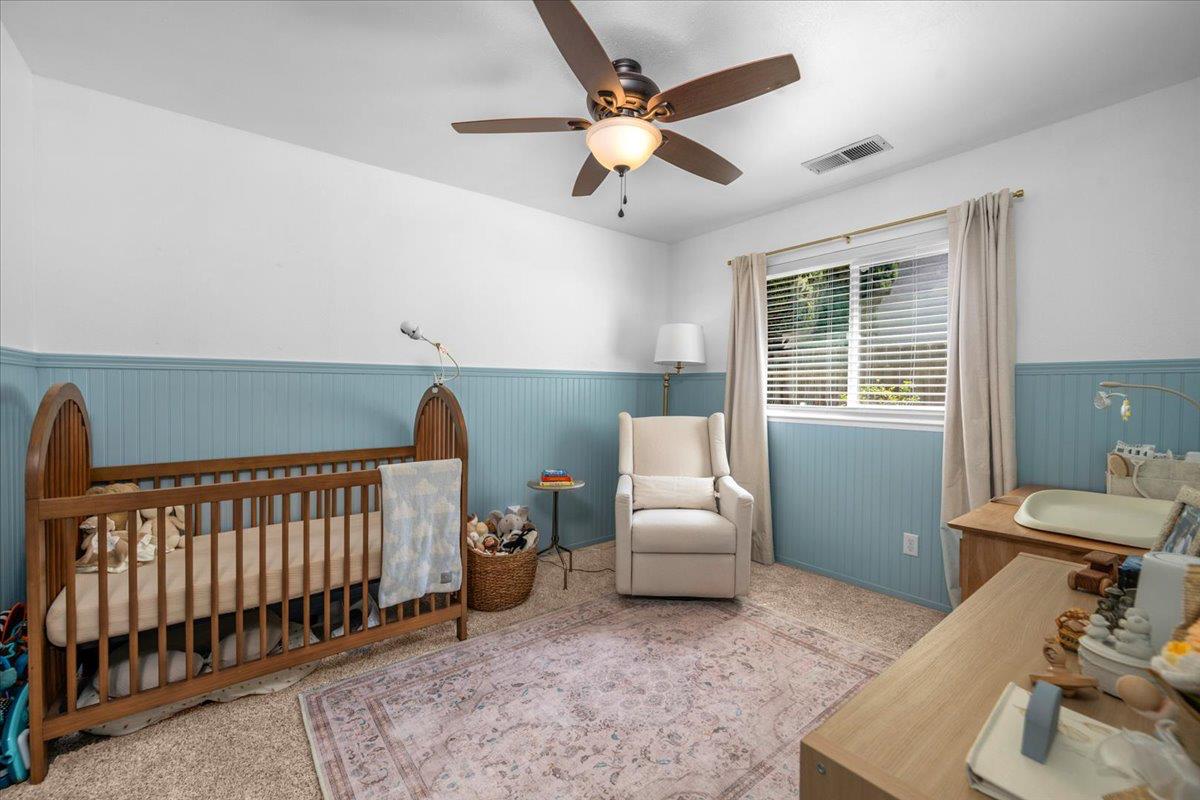 1448 Ashcroft Avenue Clovis, CA 93611 - Photo 28 of 46 a bedroom with furniture and a window