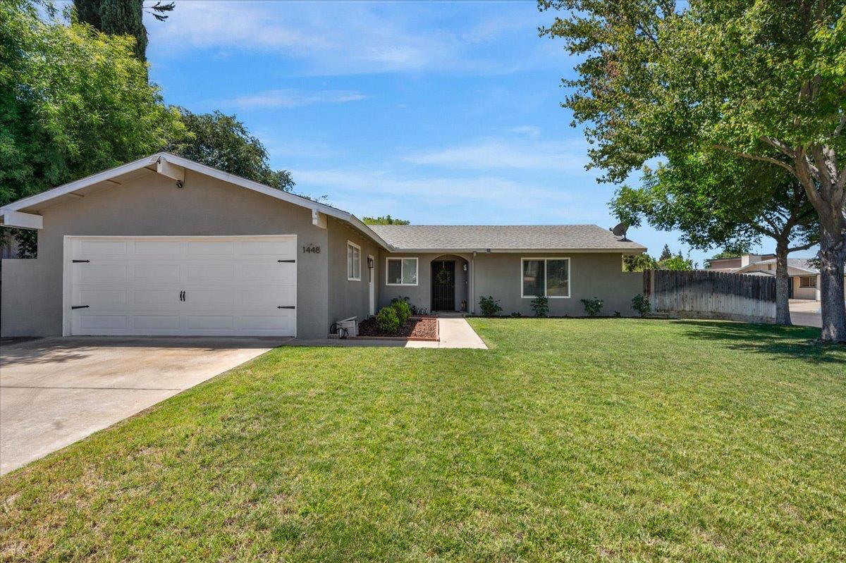 1448 Ashcroft Avenue Clovis, CA 93611 - Photo 3 of 46 a house view with a garden space