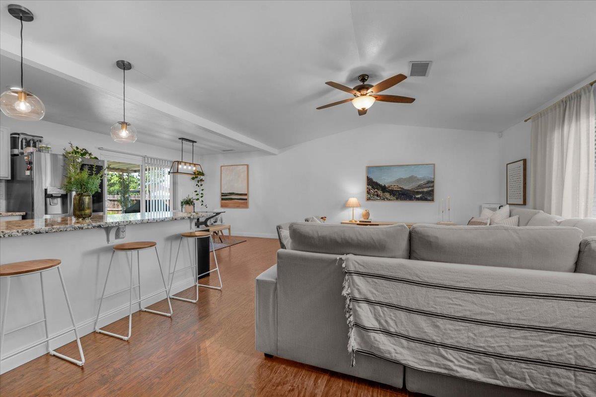 1448 Ashcroft Avenue Clovis, CA 93611 - Photo 4 of 46 a living room with furniture a ceiling fan and a rug