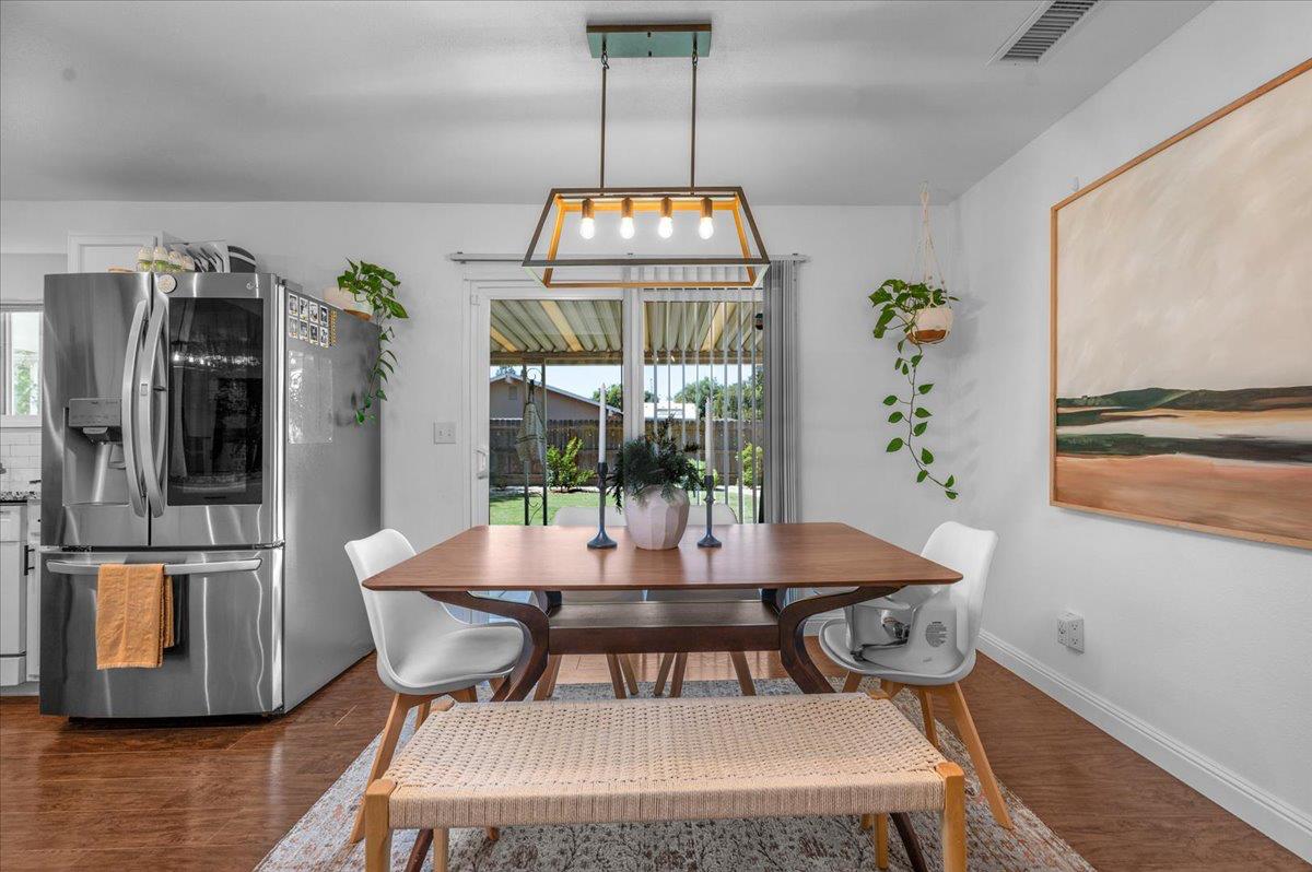 1448 Ashcroft Avenue Clovis, CA 93611 - Photo 8 of 46 a view of a dining room with furniture window and wooden floor