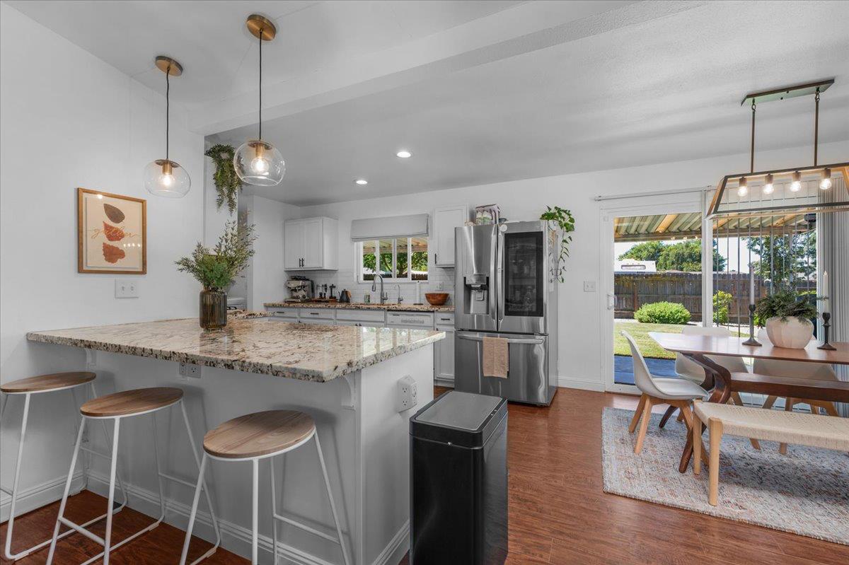 1448 Ashcroft Avenue Clovis, CA 93611 - Photo 10 of 46 a kitchen with stainless steel appliances granite countertop counter space a sink and cabinets