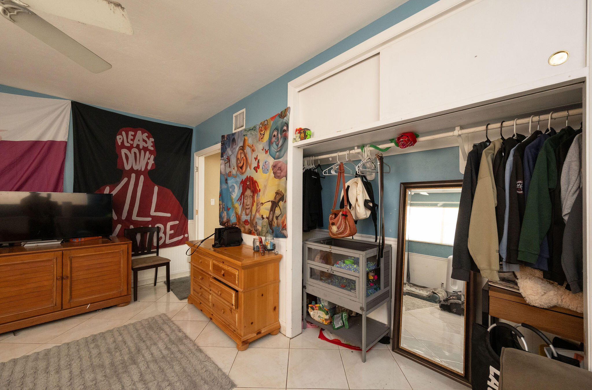 1409 4th Street Key West, FL 33040 - Photo 26 of 58 a view of walk in closet with clothes and shoes