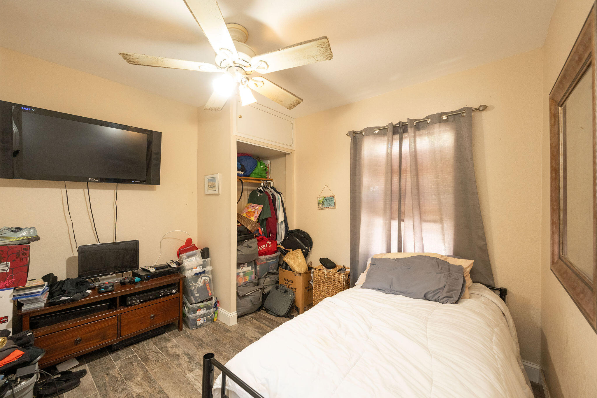 1409 4th Street Key West, FL 33040 - Photo 3 of 58 a bedroom with a bed and a flat screen tv