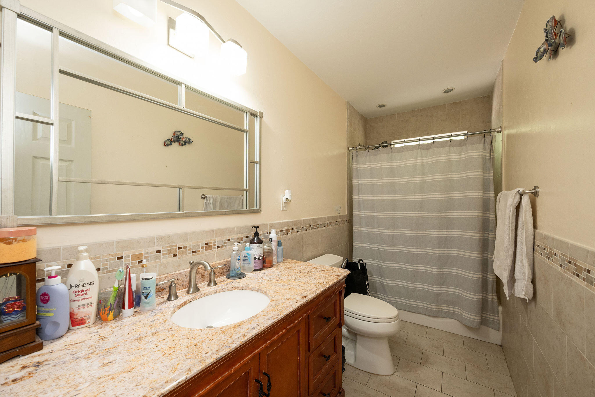 1409 4th Street Key West, FL 33040 - Photo 33 of 58 a bathroom with a granite countertop sink toilet and shower