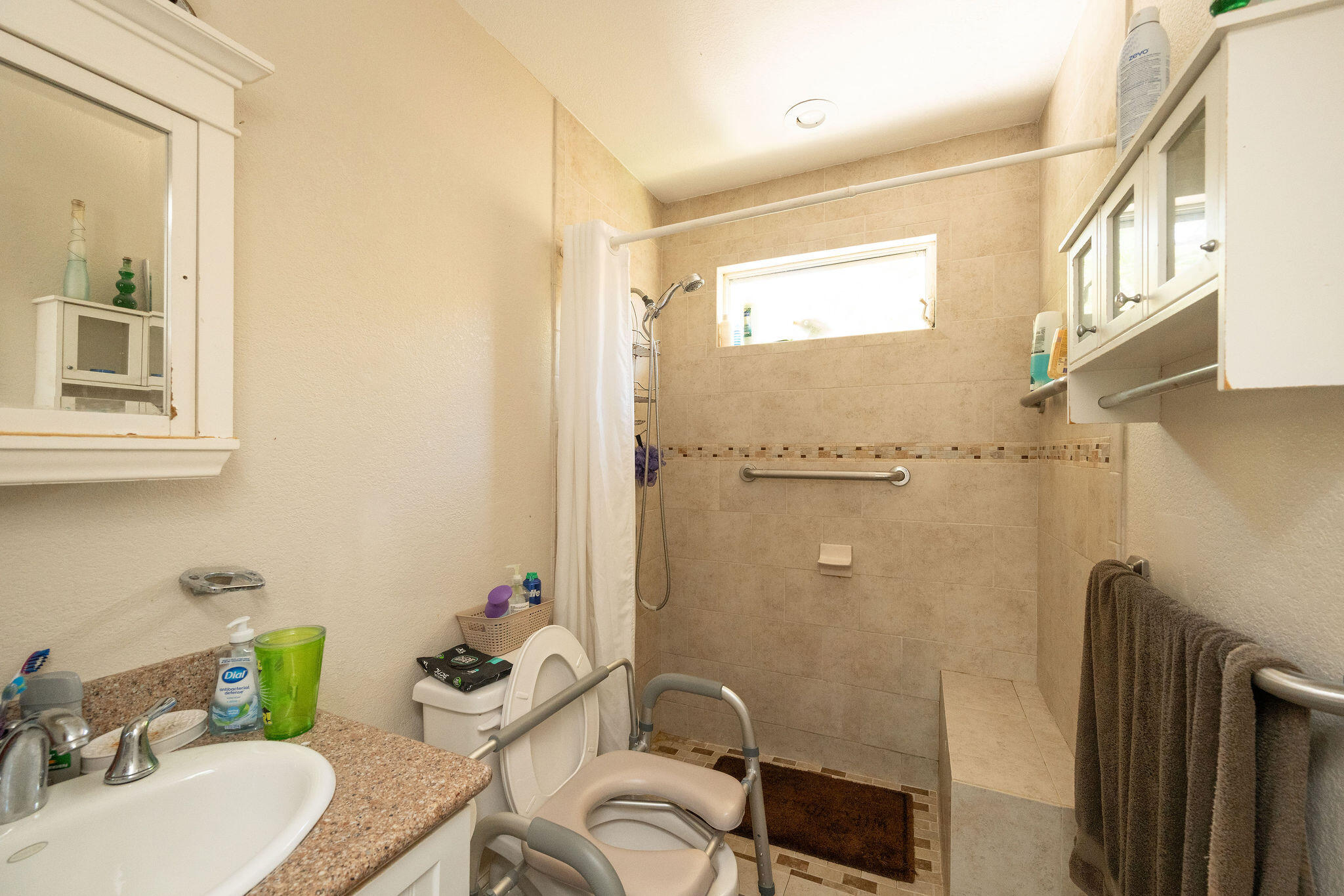 1409 4th Street Key West, FL 33040 - Photo 43 of 58 a bathroom with a sink a toilet and a mirror