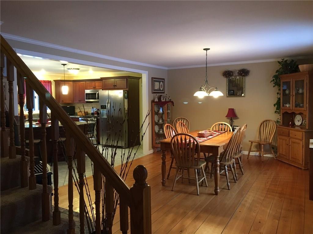 1282 Carmel Road North Hampden, ME 04444 - Photo 9 of 34 View of dining area, kitchen, stairway