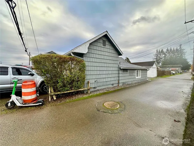 a view of a cars park in front of a building