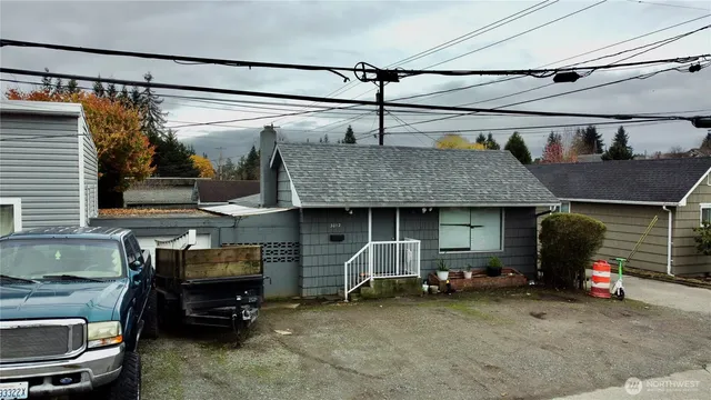 a view of a cars park in front of a building