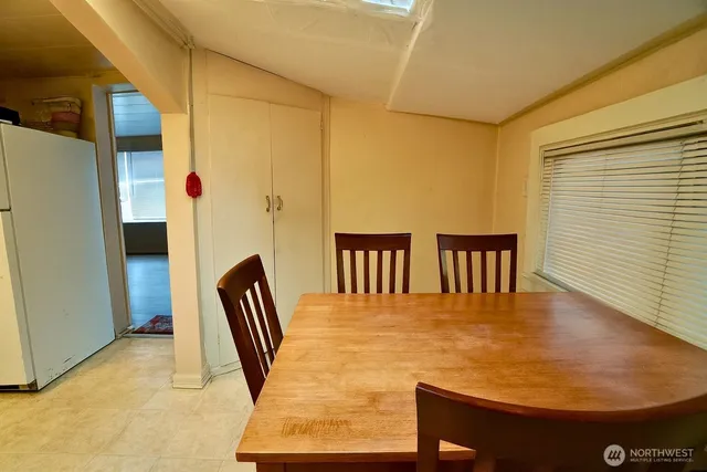 a kitchen with stainless steel appliances a refrigerator and a stove