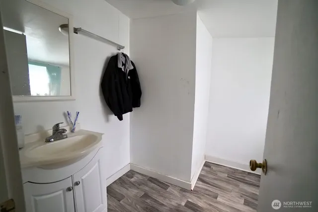 a bedroom with a bed and a mirror