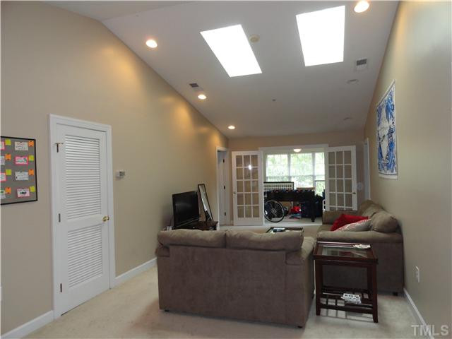 929 Morreene Road, Unit C34 Durham, NC 27705 - Photo 10 of 23 Cathedral ceilings and skylights accent the living room. The sunroom/study just off the living room is a great multipurpose area with high speed internet, cable & phone. Living Room