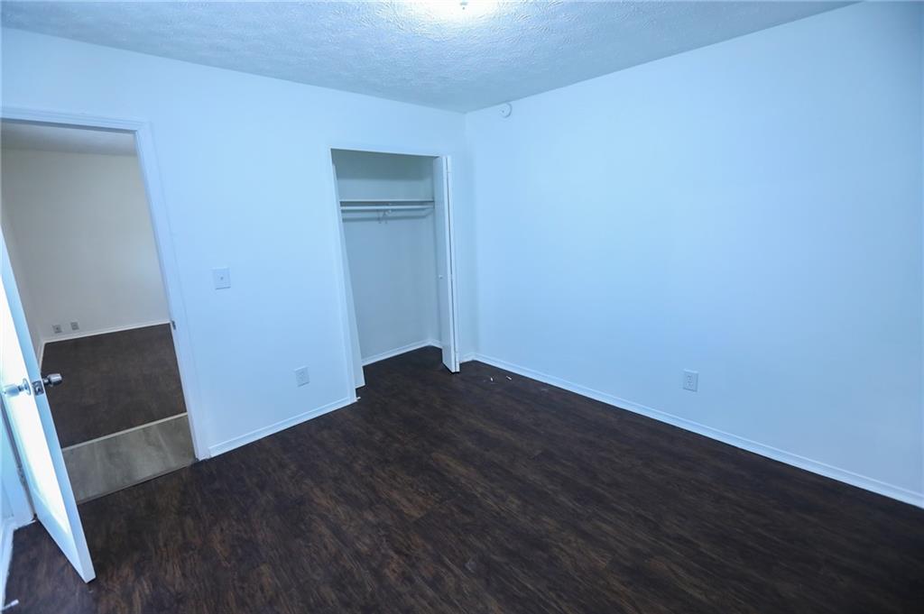 1967 Singer Way Lithonia, GA 30058 - Photo 16 of 28 an empty room with wooden floor and sink
