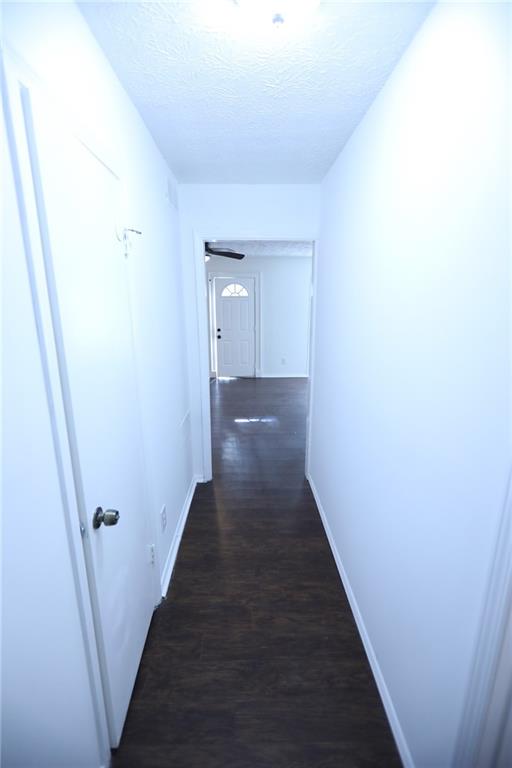 1967 Singer Way Lithonia, GA 30058 - Photo 20 of 28 a view of a hallway with wooden floor