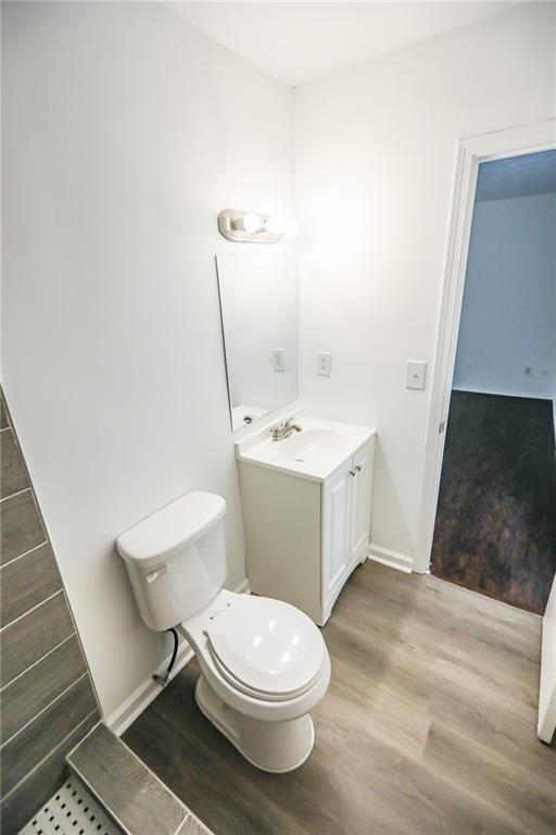 1967 Singer Way Lithonia, GA 30058 - Photo 23 of 28 a white toilet sitting next to a bathroom sink