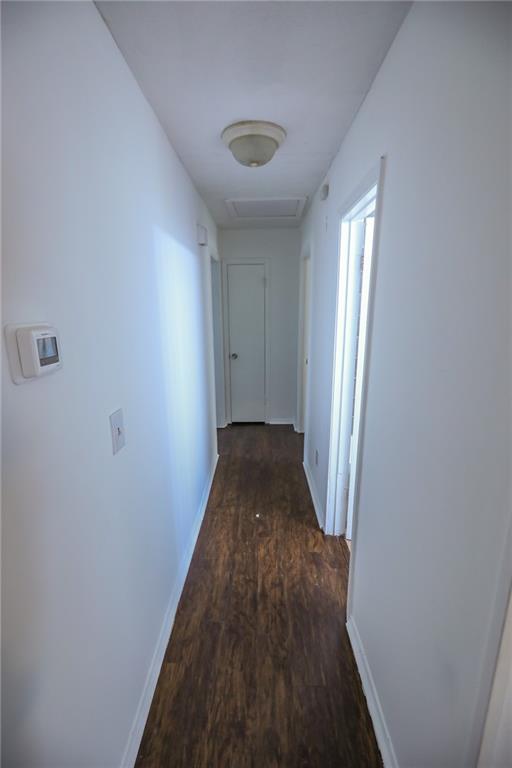 1967 Singer Way Lithonia, GA 30058 - Photo 27 of 28 a view of a hallway with wooden floor and staircase