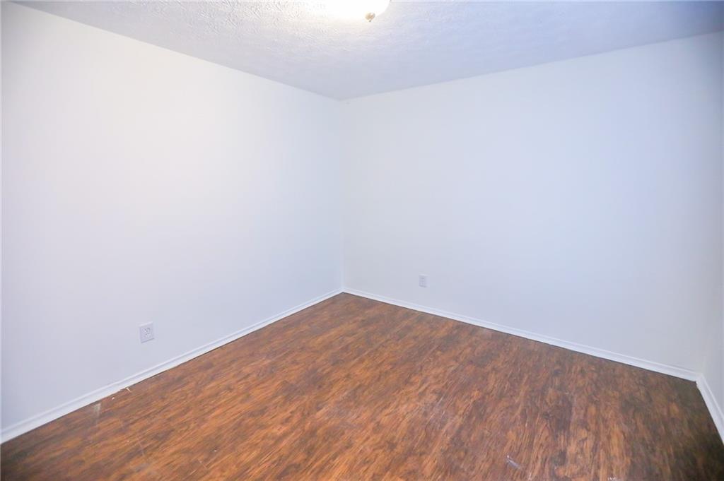 1967 Singer Way Lithonia, GA 30058 - Photo 9 of 28 a view of empty room with wooden floor
