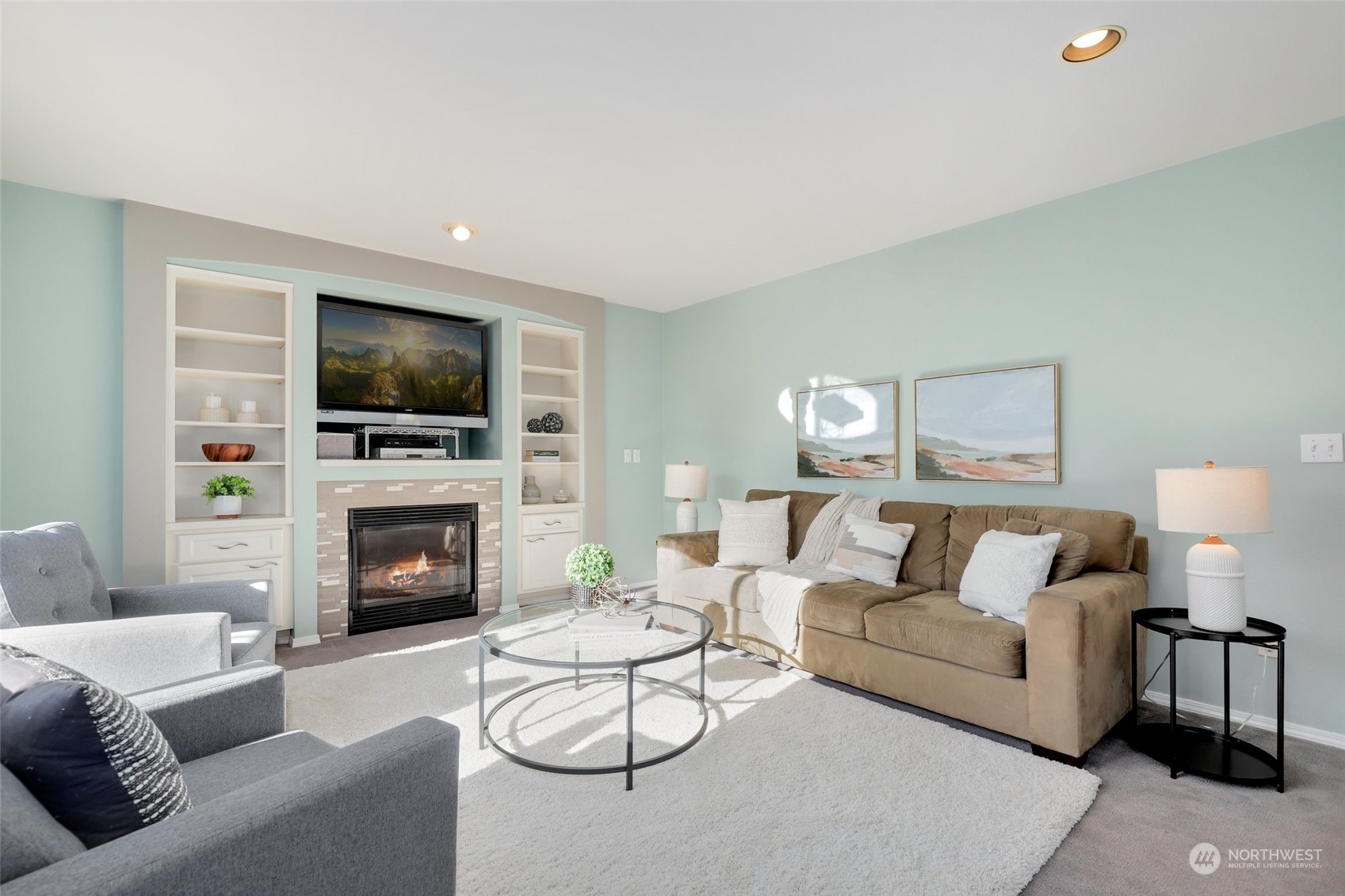23303 14th Place West Bothell, WA 98021 - Photo 13 of 30 a living room with furniture a flat screen tv and a fireplace