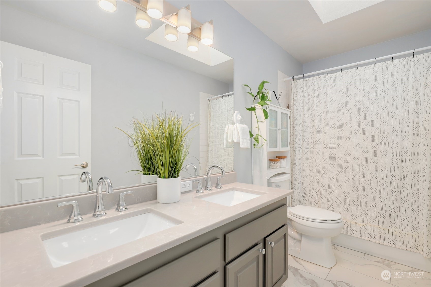 23303 14th Place West Bothell, WA 98021 - Photo 23 of 30 a bathroom with a granite countertop sink a toilet and a mirror