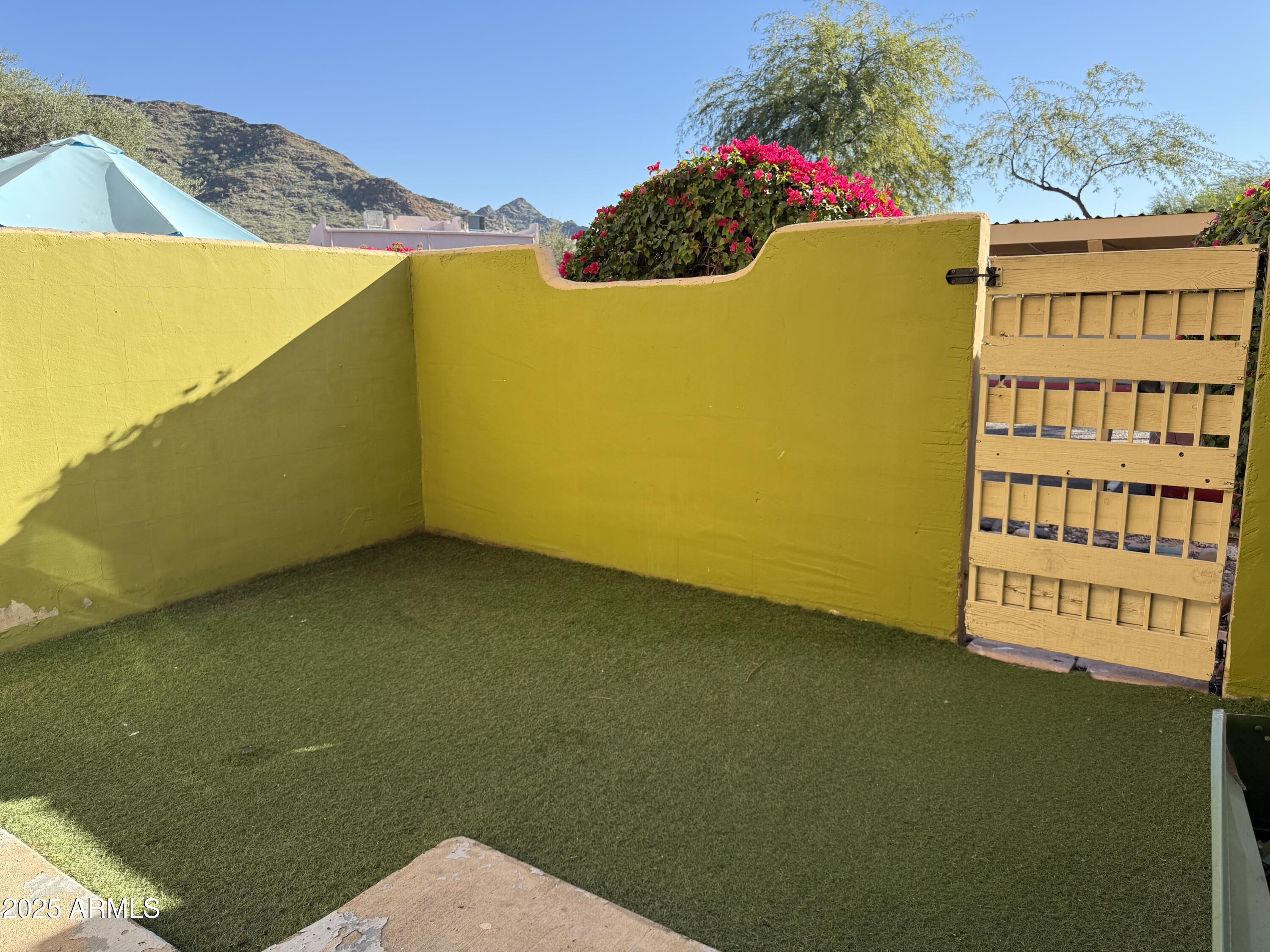 1425 East Desert Cove Avenue East, Unit 66 Phoenix, AZ 85020 - Photo 4 of 17 a view of a swimming pool and an outdoor space