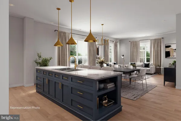 a kitchen with stainless steel appliances granite countertop a lot of cabinets and couches