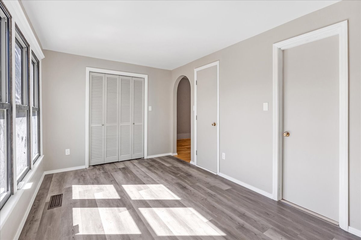 613 New Hope Road Manchester, TN 37355 - Photo 17 of 50 a view of an empty room with wooden floor and a window
