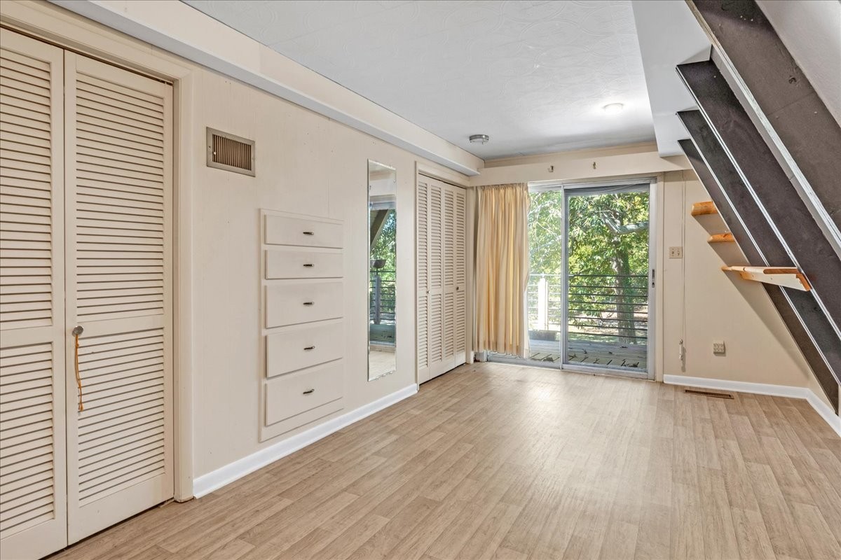 613 New Hope Road Manchester, TN 37355 - Photo 23 of 50 wooden floor in an empty room with a window