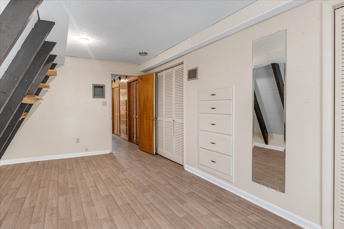 613 New Hope Road Manchester, TN 37355 - Photo 24 of 50 wooden floor in an empty room with a window