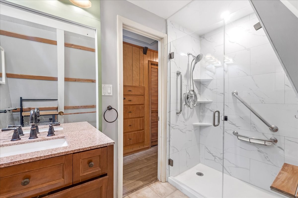 613 New Hope Road Manchester, TN 37355 - Photo 27 of 50 a bathroom with a shower sink and mirror