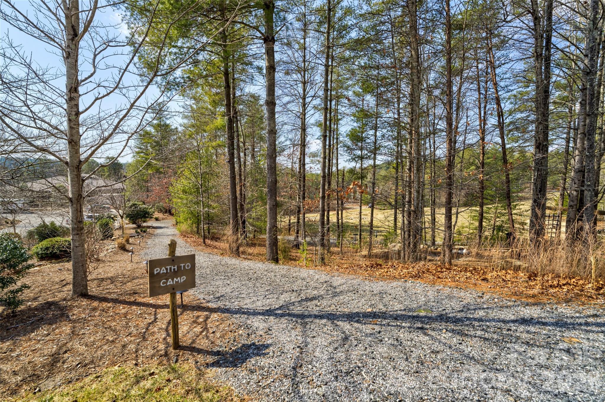 2086 October Drive, Unit 147 Nebo, NC 28761 - Photo 26 of 29 a backyard of a house with table and chairs