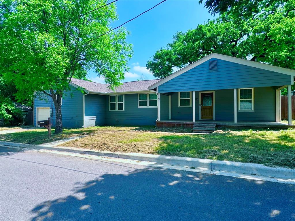 314 North Dubellette Street Weatherford, TX 76086 - Photo 1 of 30 a view of a house with a yard and large tree
