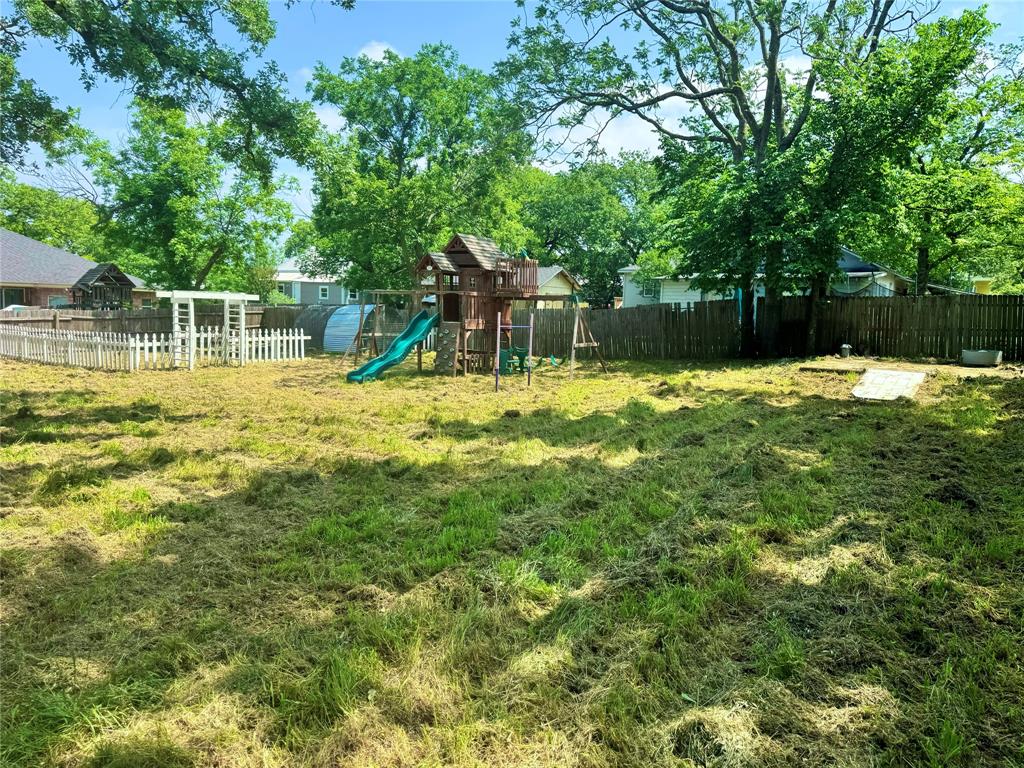 314 North Dubellette Street Weatherford, TX 76086 - Photo 17 of 30 a view of a house with a yard and sitting area