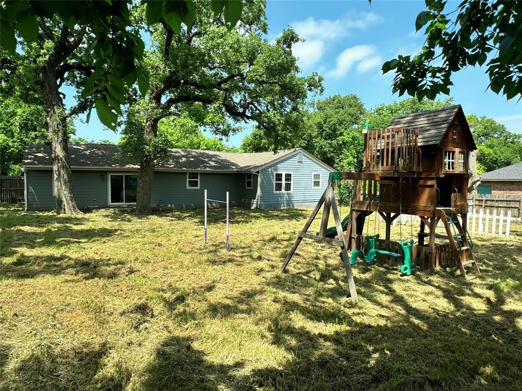 314 North Dubellette Street Weatherford, TX 76086 - Photo 20 of 30 a house view with a garden space