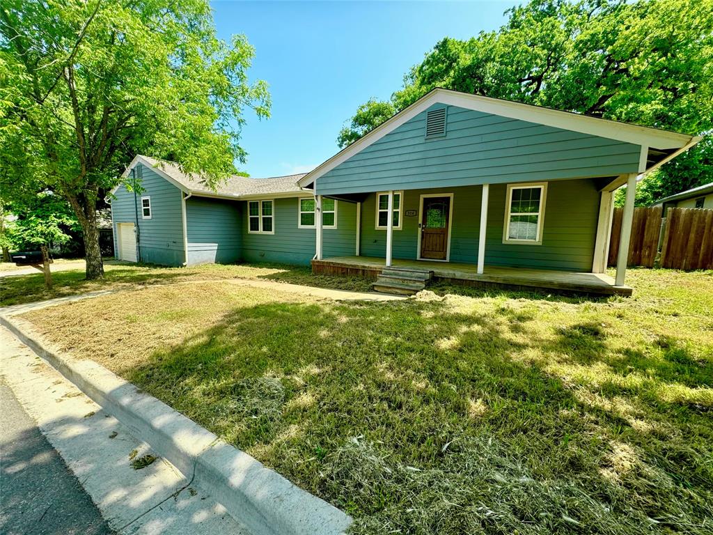314 North Dubellette Street Weatherford, TX 76086 - Photo 2 of 30 a front view of a house with a yard