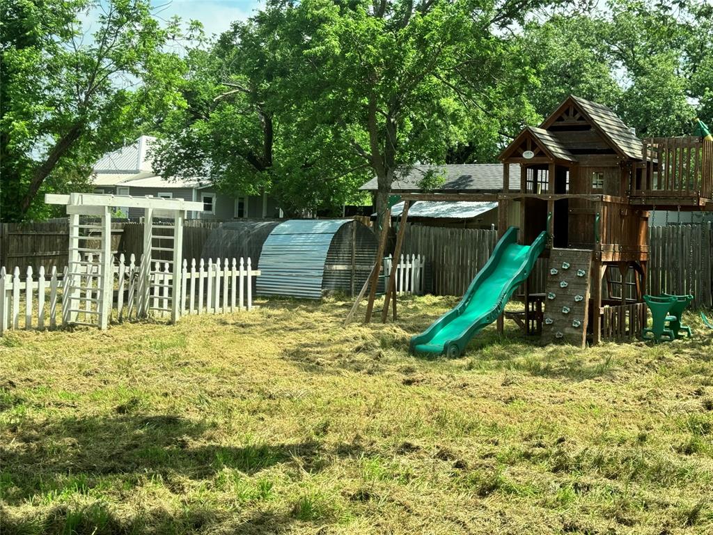 314 North Dubellette Street Weatherford, TX 76086 - Photo 30 of 30 a view of a house with a yard and sitting area