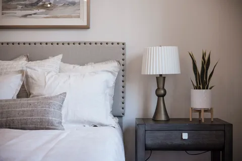 a bedroom with a bed and ceiling fan