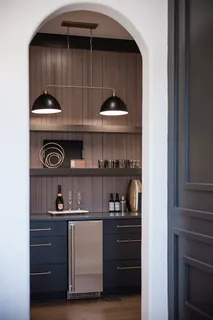 a kitchen with a cabinets and a wooden floor