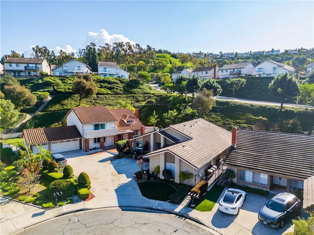 an aerial view of a house with a garden