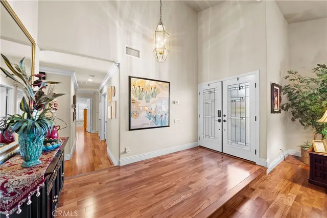 a dining room with furniture a rug and wooden floor