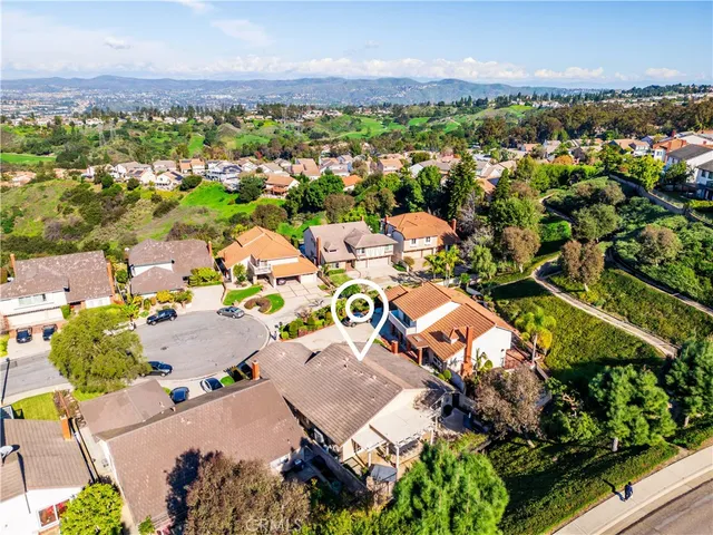 an aerial view of a house with a garden